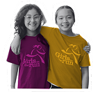 Two smiling girls standing side by side wearing Girls on the Run t-shirts, one magenta and one gold